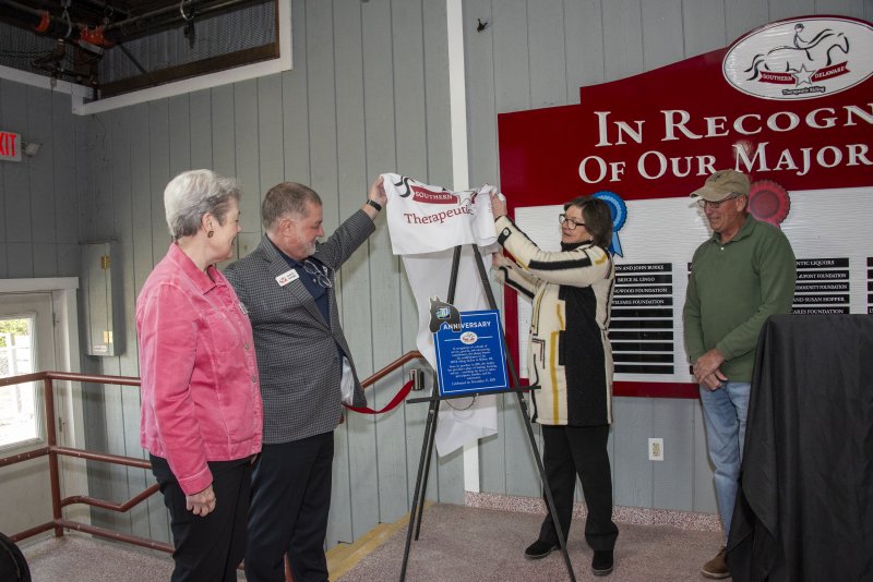 Board members unveil a 10-year commemorative plaque, celebrating the local community and sharing a vision for continued growth. Shown are (l-r) Mary Anne Hoopes, SDTR board secretary; Scott Swingle, president; Linda Berdine, vice president; and Tom Peet, facility chair. DENY HOWETH PHOTOS